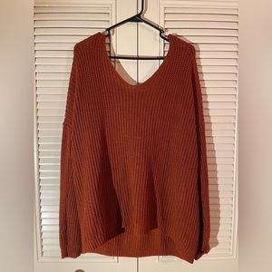 Knit low cut, open back sweater
